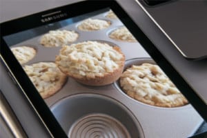 An image of tarts with crumbled topping in a muffin pan