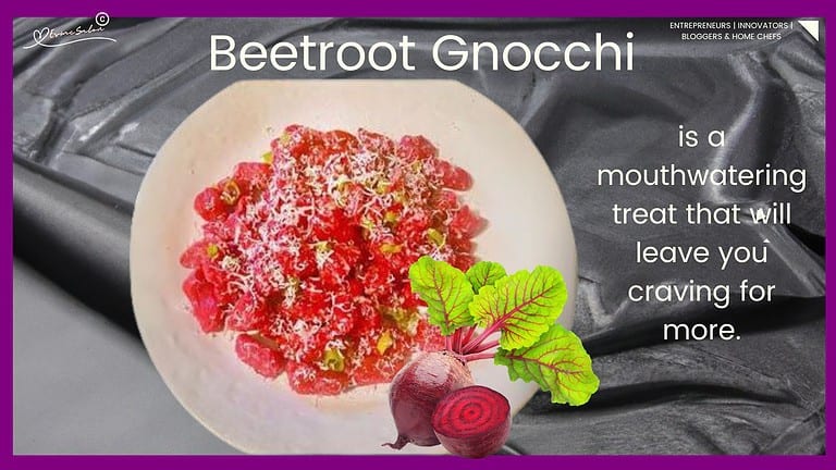 An image of Beetroot Gnocchi on a white plate garnished with grated parmesan 