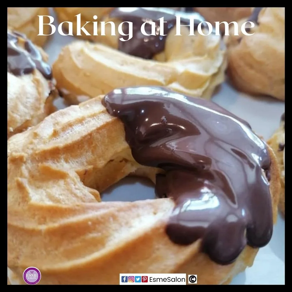 an image of choux pastry piped in a circle and baked and dipped in chocolate