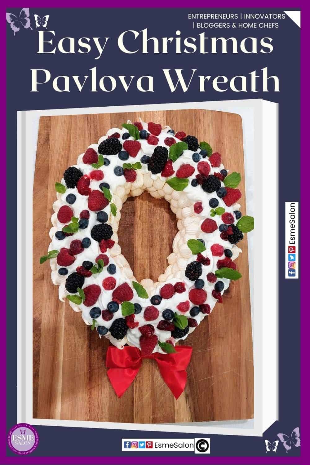 an image of a round Christmas Pavlova Wreath with lots of fruit, mint leaves and a red bow red at the bottom