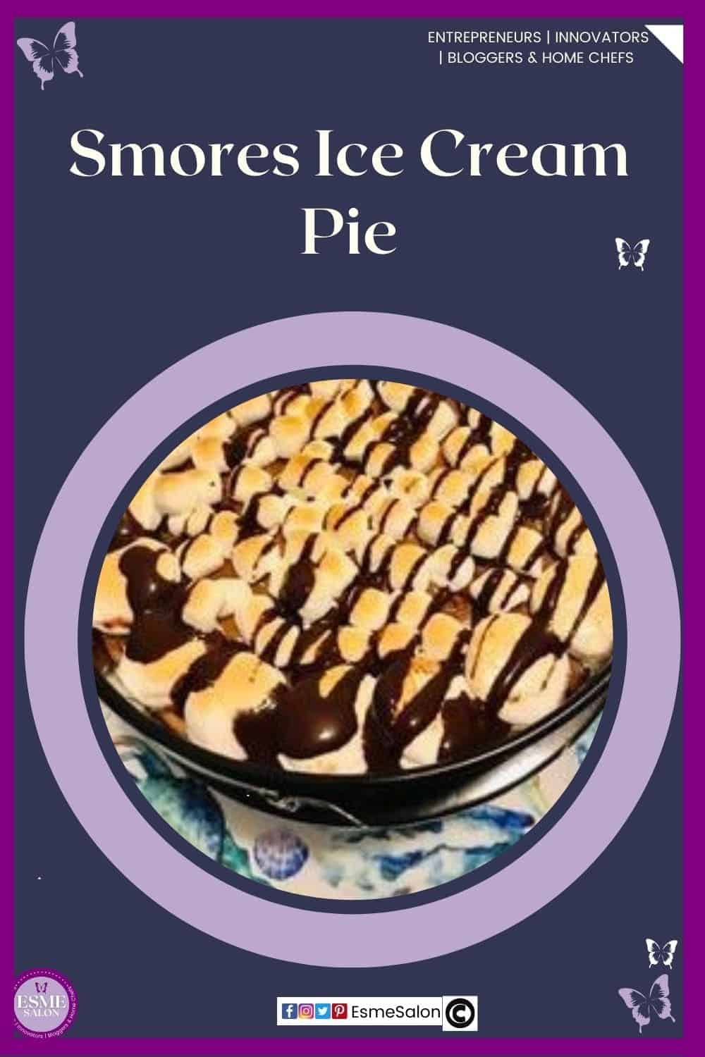 an image of a springform pan with a Smores Ice Cream Pie drizzled with chocolate