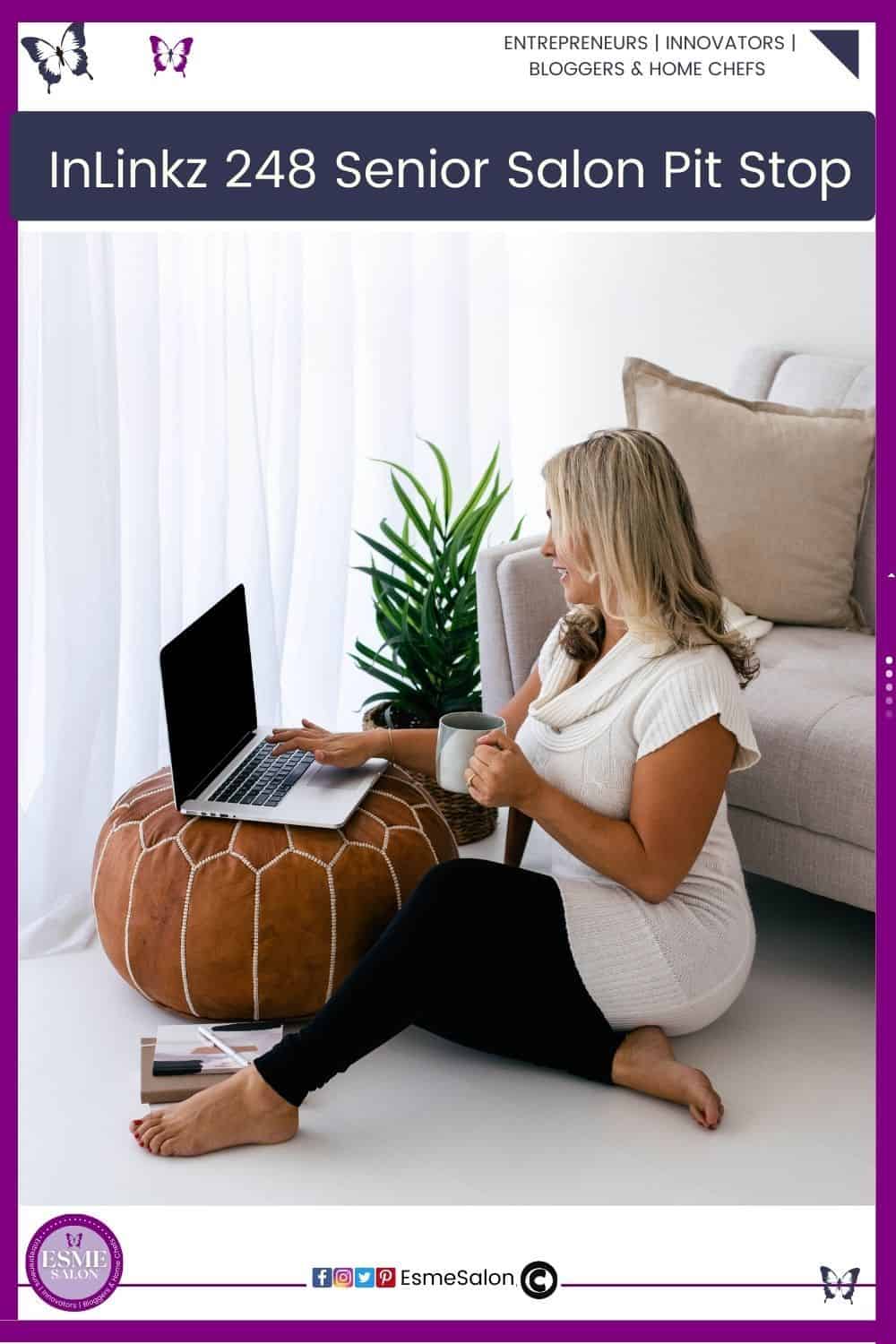An image a a lady dressed in black stretch pants, with a white short sleeve top sitting on the floor behind a round brown cushion with her laptop and holding a mug of coffee