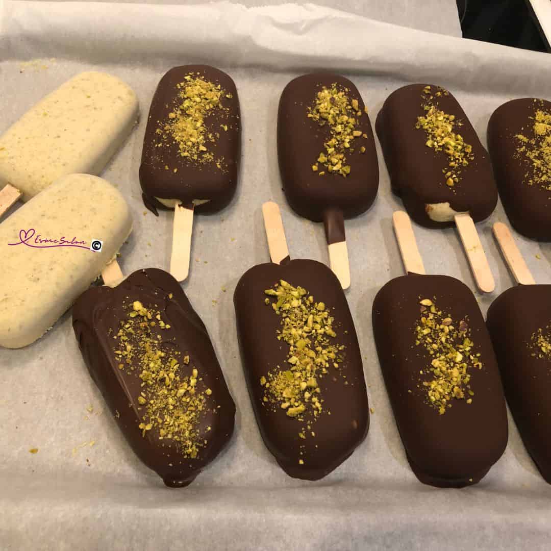 an image of Pistachio Magnums Vegan Gluten-Free on a parchment lined baking tray ready to go into the freezer