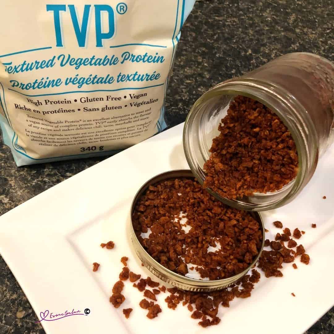 an image of a white plate and Consol jar with Easy Vegan Gluten-Free TVP Bacon Bits