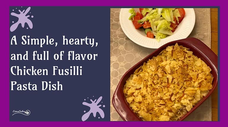 an image of a Chicken Fusilli Pasta Dish with crushed chips as topping and a side of salad