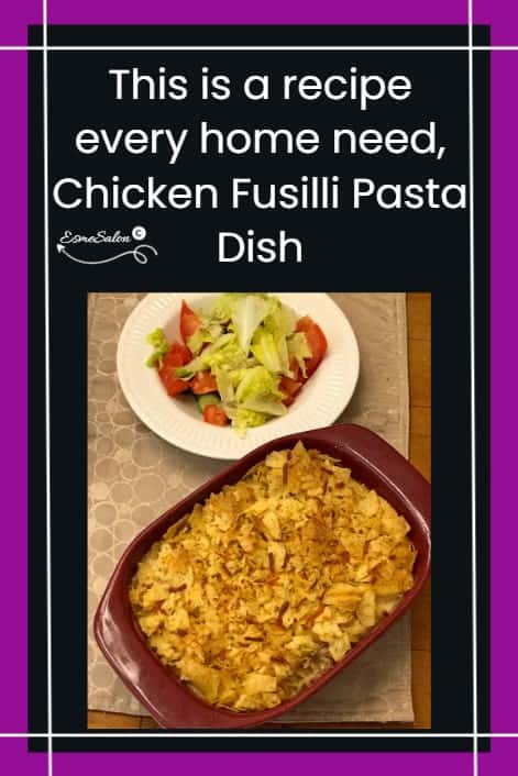 an image of a Chicken Fusilli Pasta Dish with crushed chips as topping and a side of salad