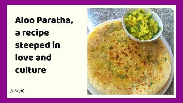 an image of a plate with Aloo Paratha and filling on the side
