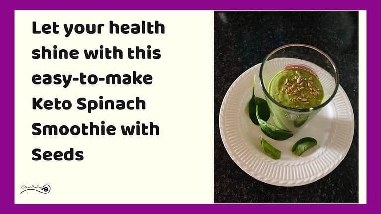 an image of a glass of Keto Spinach Smoothie with Seeds on a white plate with spinach leaves