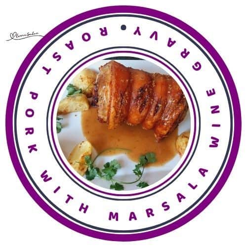 an image of Roast Pork with Marsala Wine Gravy with roasted poratoes on the side