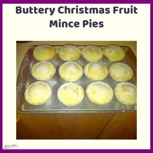 An image of a baking tray and wooden platter with Buttery Christmas Fruit Mince Pies