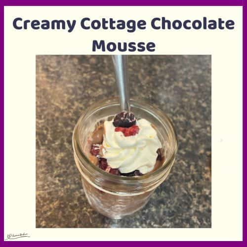 An image of a small Console jar with Creamy Cottage Chocolate Mousse, fruit and a dollop of cream