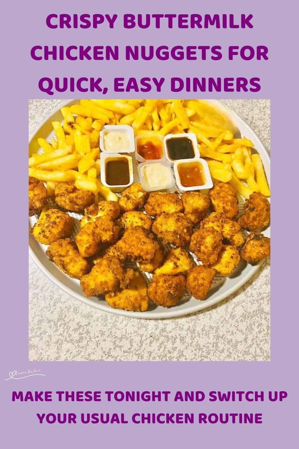 An image of a round white dish filled with Crispy Buttermilk Chicken Nuggets and Fries with condiments