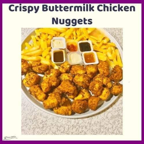 An image of a round white dish filled with Crispy Buttermilk Chicken Nuggets and Fries with condiments