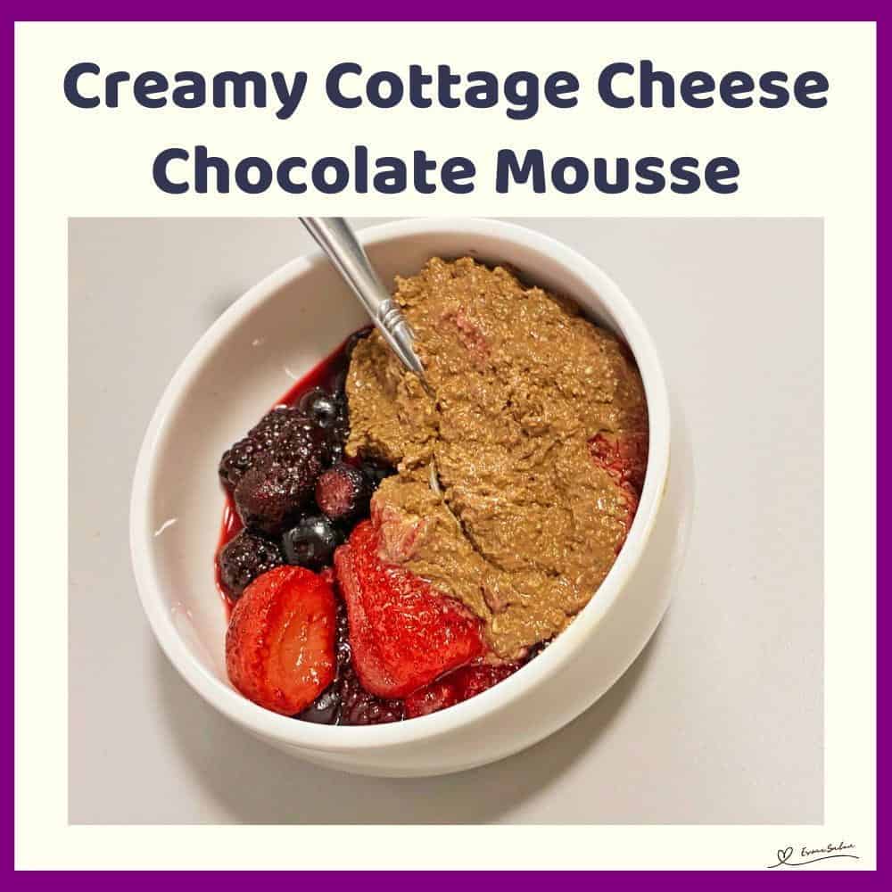 An image of a white bowl with Creamy Cottage Cheese Chocolate Mousse and a variety of berries