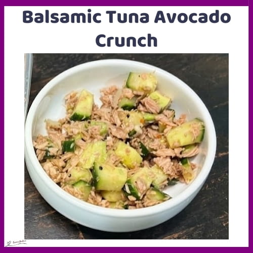 An image of a bowl of Balsamic Tuna Avocado Crunch, with tuna, onion, cucumber, avocado, and balsamic