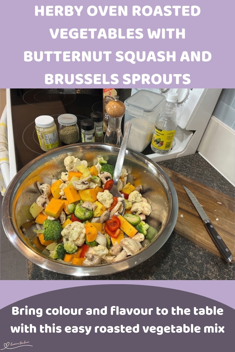 An image of a pan filled with oven-roasted vegetables: butternut squash, cauliflower florets, broccoli florets, Brussels sprouts, Mushrooms, Red pepper, white onion and potatoes