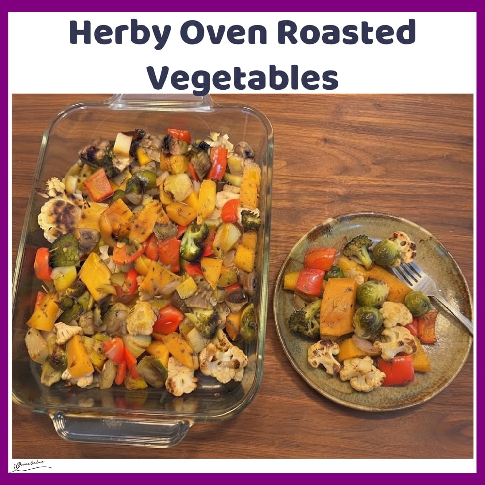 An image of a pan filled with oven-roasted vegetables: butternut squash, cauliflower florets, broccoli florets, Brussels sprouts, Mushrooms, Red pepper, white onion and potatoes